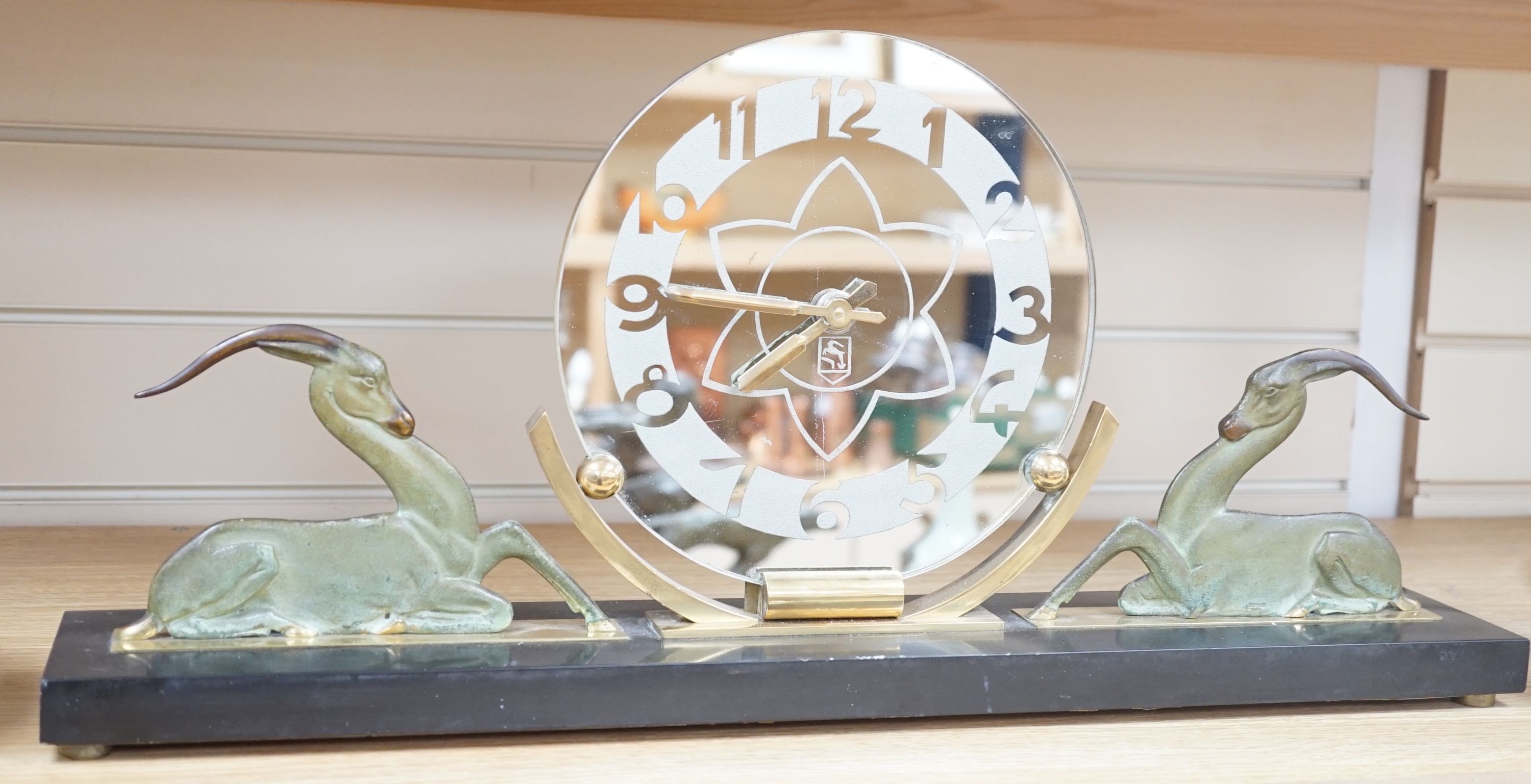 An Art Deco bronze and black slate ‘antelope’ mantel timepiece, 62cm